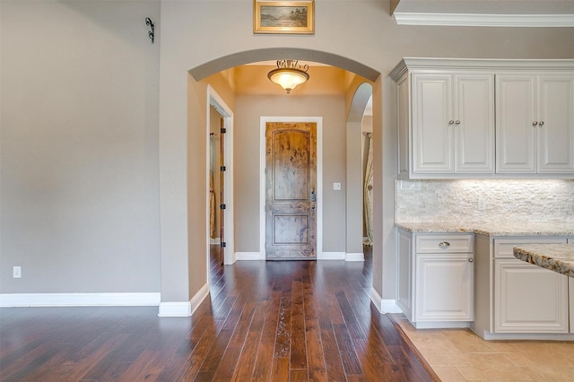 160 Solano Cir, Aledo, TX 76008 - entrance foyer with arched walkways, baseboards, hardwood / wood-style floors, and ornamental molding