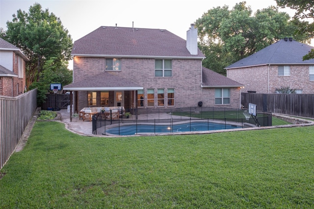 7002 Clear Springs Pkwy, Garland, TX 75044 - rear view of property with brick siding, a chimney, a patio area, and an outdoor hangout area