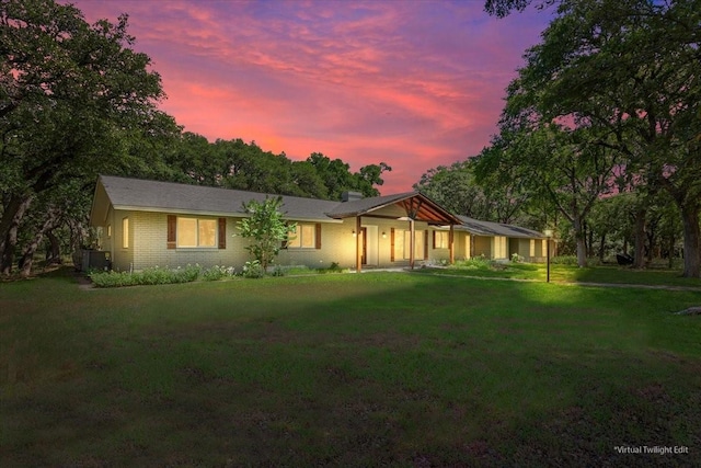 4732 Baylor Camp Rd, Crawford, TX 76638 - single story home with a lawn, a chimney, brick siding, and central AC