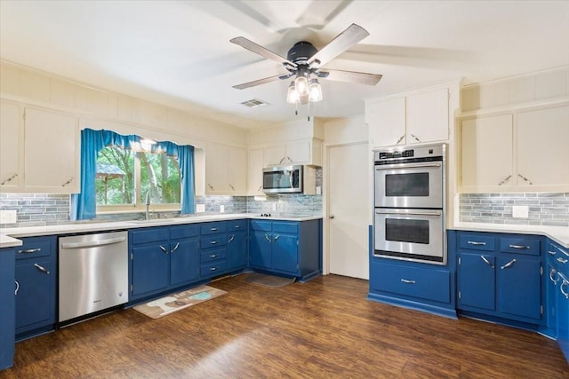 4732 Baylor Camp Rd, Crawford, TX 76638 - kitchen with appliances with stainless steel finishes, blue cabinets, tasteful backsplash, and ceiling fan