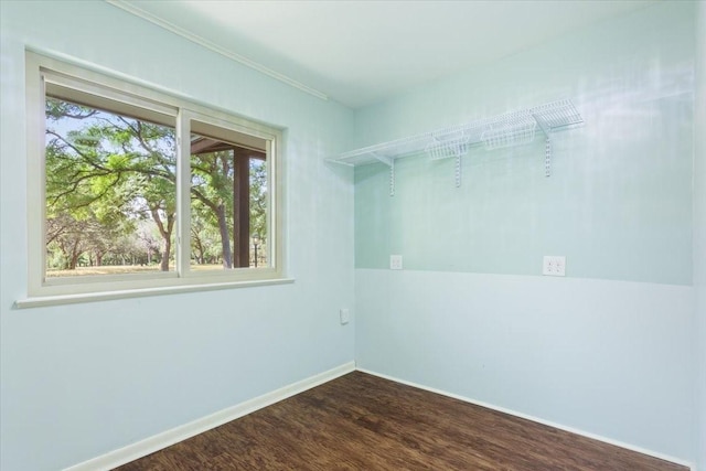 4732 Baylor Camp Rd, Crawford, TX 76638 - spare room featuring dark wood-type flooring, baseboards, and crown molding