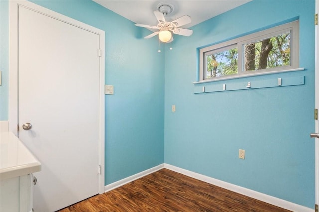 4732 Baylor Camp Rd, Crawford, TX 76638 - unfurnished dining area with a ceiling fan, dark wood-style flooring, and baseboards