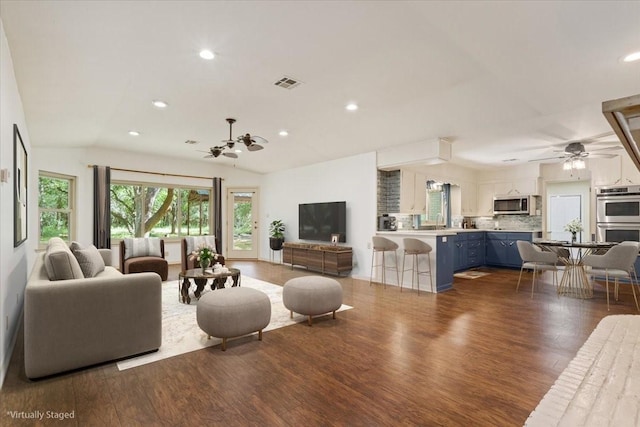 4732 Baylor Camp Rd, Crawford, TX 76638 - living room with a ceiling fan, wood finished floors, vaulted ceiling, and recessed lighting