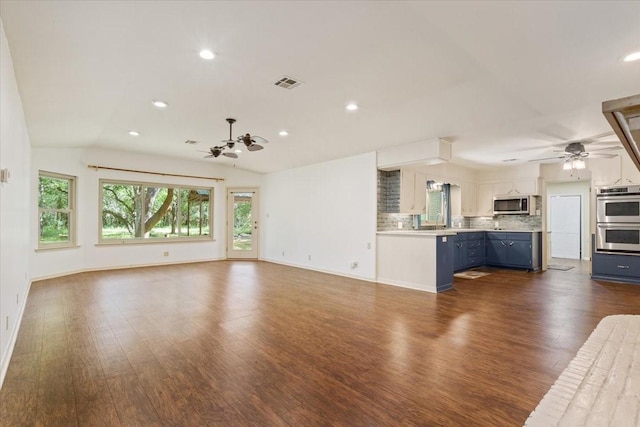 4732 Baylor Camp Rd, Crawford, TX 76638 - unfurnished living room with a ceiling fan, dark wood-style flooring, recessed lighting, vaulted ceiling, and baseboards