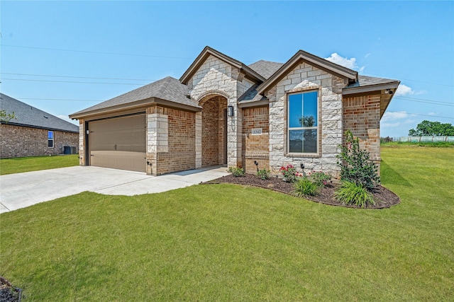 1342 Oleander Dr, Tolar, TX 76476 - french country inspired facade with stone siding, an attached garage, driveway, a front lawn, and central air condition unit