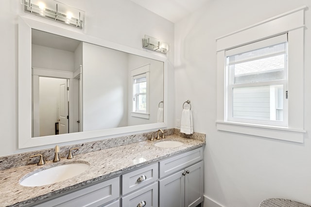 13340 Shumate Way, Malakoff, TX 75148 - bathroom with double vanity, healthy amount of natural light, and baseboards