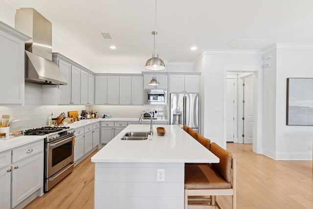 13340 Shumate Way, Malakoff, TX 75148 - kitchen featuring a sink, appliances with stainless steel finishes, wall chimney range hood, light wood-style floors, and crown molding