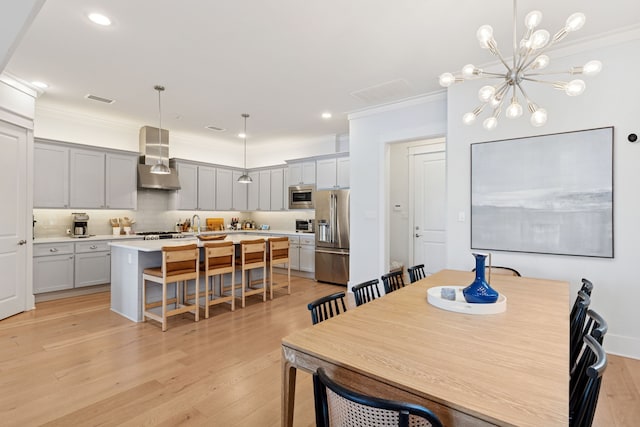 13340 Shumate Way, Malakoff, TX 75148 - dining space with ornamental molding, light wood-style flooring, a chandelier, and recessed lighting