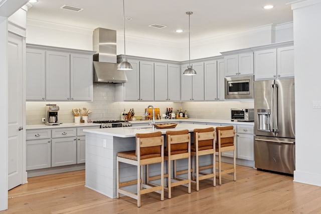 13340 Shumate Way, Malakoff, TX 75148 - kitchen featuring appliances with stainless steel finishes, wall chimney exhaust hood, tasteful backsplash, a sink, and crown molding