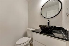 1320 E 3rd Ave, Corsicana, TX 75110 - half bath featuring toilet and vanity