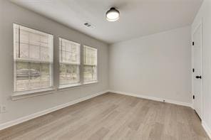 1320 E 3rd Ave, Corsicana, TX 75110 - unfurnished room featuring wood finished floors and baseboards