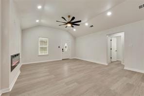 1320 E 3rd Ave, Corsicana, TX 75110 - unfurnished living room with lofted ceiling, recessed lighting, light wood-type flooring, baseboards, and a ceiling fan