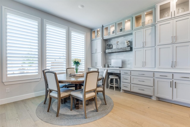 3525 Dancer Rd, Celina, TX 75009 - dining area featuring light wood finished floors and built in desk