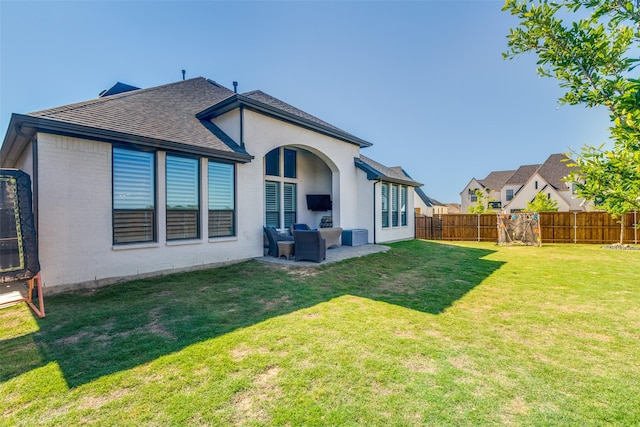3525 Dancer Rd, Celina, TX 75009 - back of property featuring a fenced backyard, brick siding, a shingled roof, and outdoor lounge area
