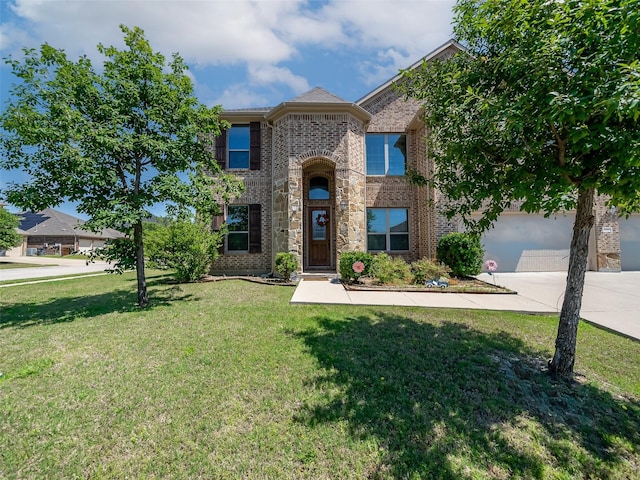 5207 Seth Ave, Sachse, TX 75048 - view of front of home with concrete driveway, brick siding, a front lawn, and a garage