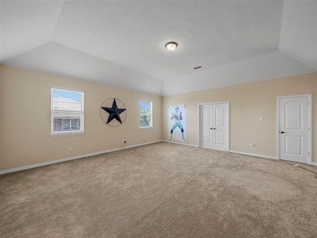 5207 Seth Ave, Sachse, TX 75048 - unfurnished bedroom with vaulted ceiling, carpet flooring, and baseboards