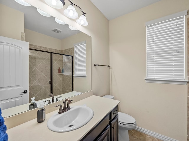 5207 Seth Ave, Sachse, TX 75048 - bathroom featuring toilet, a shower stall, vanity, tile patterned floors, and baseboards