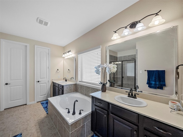 5207 Seth Ave, Sachse, TX 75048 - bathroom with two vanities, a garden tub, a stall shower, and tile patterned floors