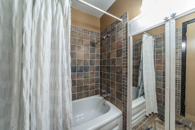 408 Davis St, Weatherford, TX 76086 - bathroom featuring shower / tub combo with curtain and tile walls