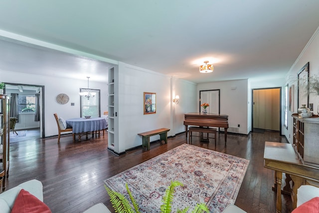 408 Davis St, Weatherford, TX 76086 - living room featuring hardwood / wood-style flooring and a chandelier