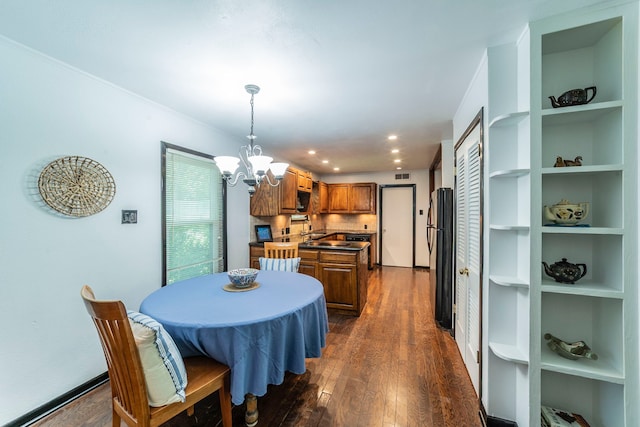 408 Davis St, Weatherford, TX 76086 - dining area featuring a chandelier, dark wood-type flooring, and recessed lighting