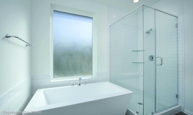 3806 Aqua Ln, Sherman, TX 75090 - full bathroom with tile walls, a freestanding tub, a shower stall, and recessed lighting