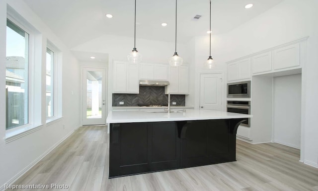 3806 Aqua Ln, Sherman, TX 75090 - kitchen featuring stainless steel appliances, under cabinet range hood, backsplash, white cabinetry, and recessed lighting