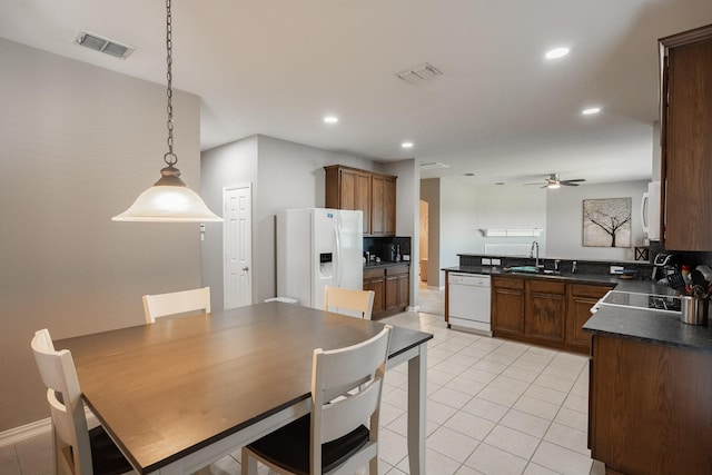 7807 Enchanted Isle Dr, Arlington, TX 76016 - kitchen with white appliances, a sink, dark countertops, ceiling fan, and recessed lighting