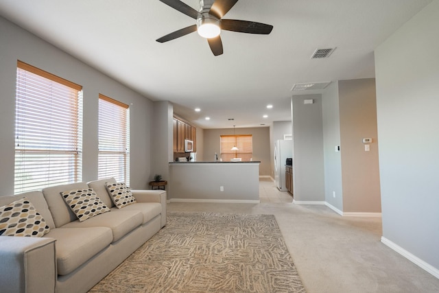 7807 Enchanted Isle Dr, Arlington, TX 76016 - living room with light carpet, a ceiling fan, baseboards, and recessed lighting