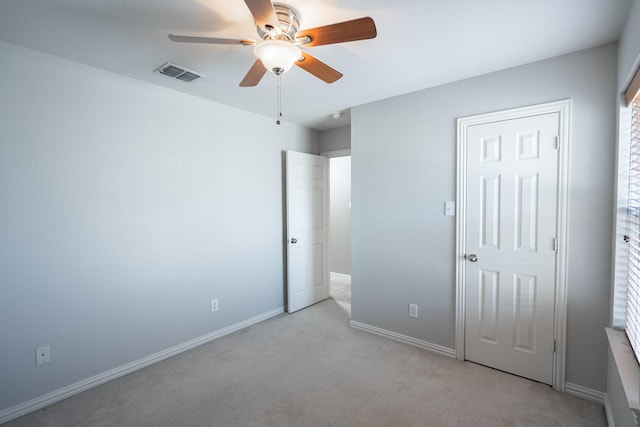 7807 Enchanted Isle Dr, Arlington, TX 76016 - unfurnished bedroom featuring light colored carpet, baseboards, and a ceiling fan