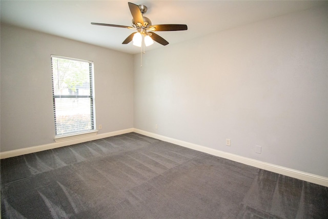 9001 Westfield Dr, Rowlett, TX 75088 - unfurnished room featuring ceiling fan, baseboards, and dark colored carpet