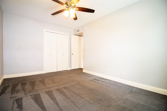 9001 Westfield Dr, Rowlett, TX 75088 - unfurnished bedroom with carpet, a closet, baseboards, and a ceiling fan