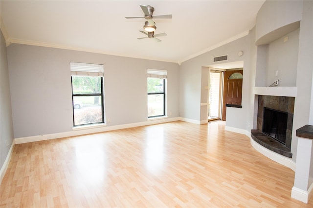 9001 Westfield Dr, Rowlett, TX 75088 - unfurnished living room with ceiling fan, light wood-style floors, vaulted ceiling, a fireplace, and baseboards