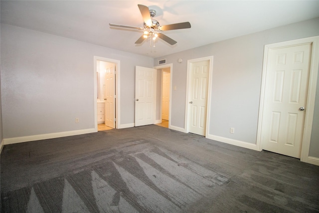 9001 Westfield Dr, Rowlett, TX 75088 - unfurnished bedroom featuring baseboards, ensuite bathroom, and carpet flooring