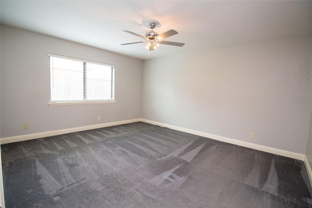 9001 Westfield Dr, Rowlett, TX 75088 - unfurnished room featuring dark colored carpet, a ceiling fan, and baseboards