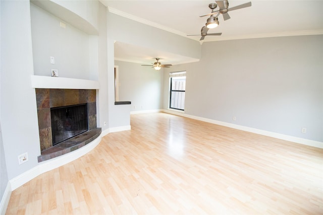 9001 Westfield Dr, Rowlett, TX 75088 - unfurnished living room with wood finished floors, a ceiling fan, ornamental molding, baseboards, and a tiled fireplace