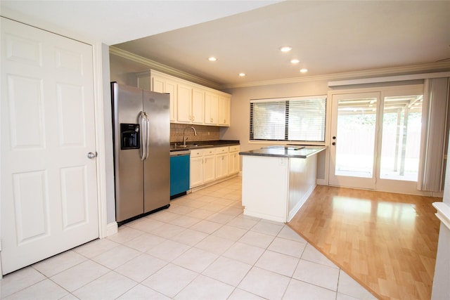 9001 Westfield Dr, Rowlett, TX 75088 - kitchen with stainless steel refrigerator with ice dispenser, dishwasher, ornamental molding, dark countertops, and a sink