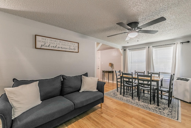408 E Baylor St, Weatherford, TX 76086 - living area featuring a textured ceiling, a ceiling fan, and wood finished floors