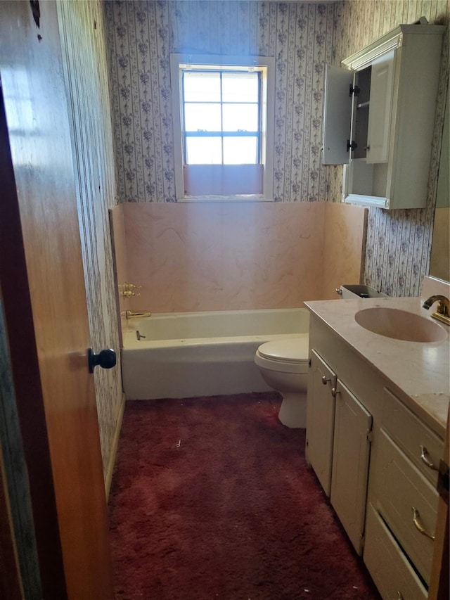 8740 County Road 2403, Tool, TX 75143 - bathroom featuring wallpapered walls, a tub to relax in, toilet, and vanity