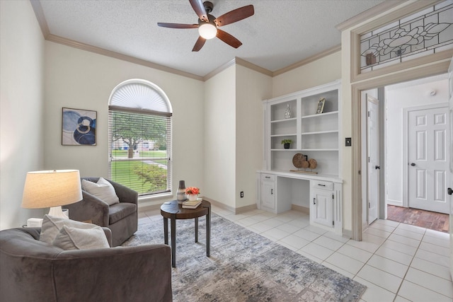 820 Windlake Cir, Heath, TX 75032 - sitting room with a ceiling fan, ornamental molding, light tile patterned floors, a textured ceiling, and a desk