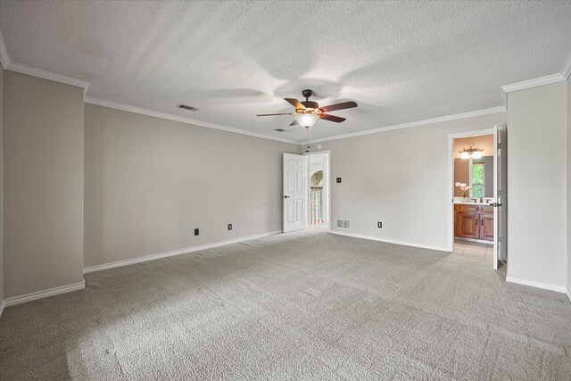 820 Windlake Cir, Heath, TX 75032 - empty room with a ceiling fan, light colored carpet, baseboards, crown molding, and a textured ceiling