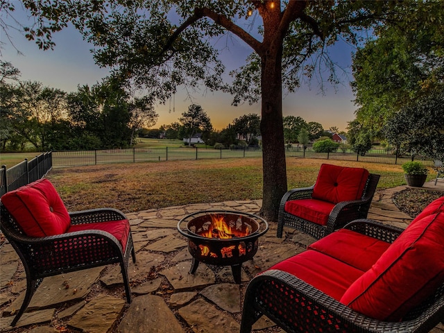 820 Windlake Cir, Heath, TX 75032 - patio terrace at dusk featuring an outdoor fire pit and a patio