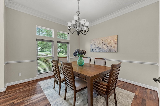 820 Windlake Cir, Heath, TX 75032 - dining room with a chandelier, crown molding, baseboards, and wood finished floors