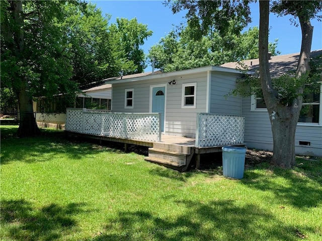 302 W Dexter St, Sherman, TX 75092 - rear view of property featuring a wooden deck and a yard