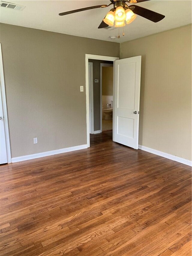 302 W Dexter St, Sherman, TX 75092 - unfurnished room with ceiling fan, baseboards, and wood finished floors
