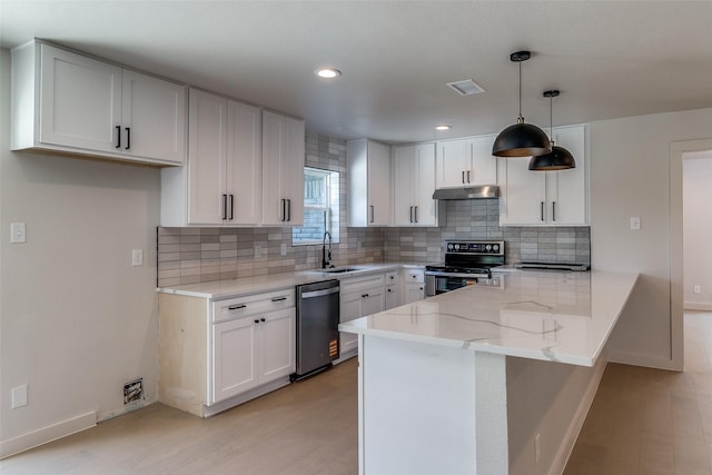 10240 Carry Back Cir, Dallas, TX 75229 - kitchen featuring appliances with stainless steel finishes, under cabinet range hood, light stone counters, a peninsula, and white cabinetry