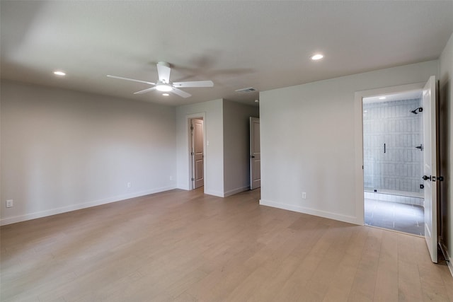 10240 Carry Back Cir, Dallas, TX 75229 - unfurnished bedroom with light wood-type flooring, baseboards, recessed lighting, and ensuite bath