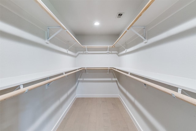 10240 Carry Back Cir, Dallas, TX 75229 - spacious closet featuring light wood-style floors