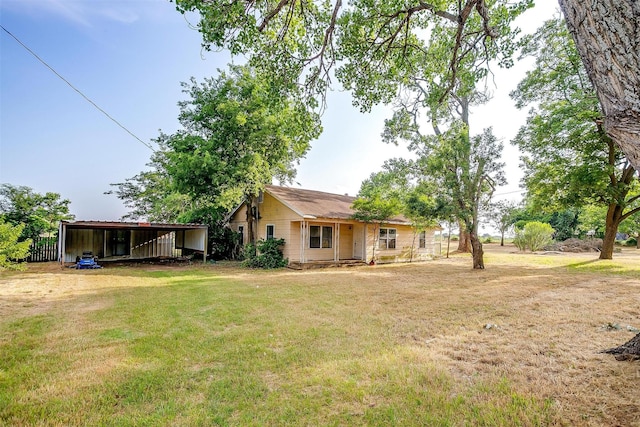 1501 County Road 909, Joshua, TX 76058 - back of house featuring a lawn