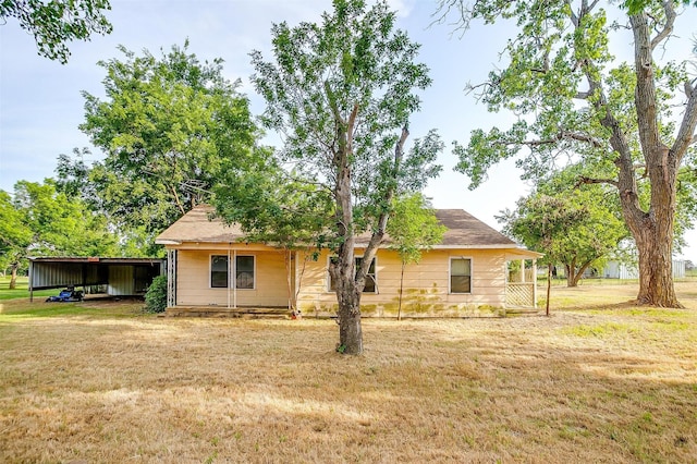 1501 County Road 909, Joshua, TX 76058 - view of front facade featuring a front yard and a detached carport